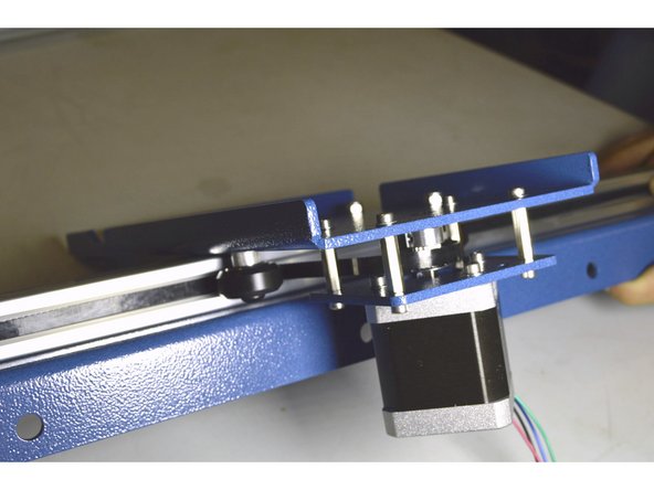 Feed the GT2 Belt below the V-wheel, over the pulley and below the V-wheel on the other side