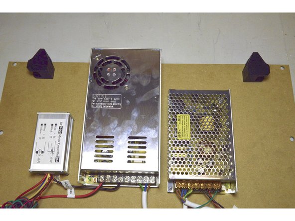 Mount the Drag Chain brackets to the Electronics board with the M4x20 cap screws (2 Pcs) and the Pratley Pratlock