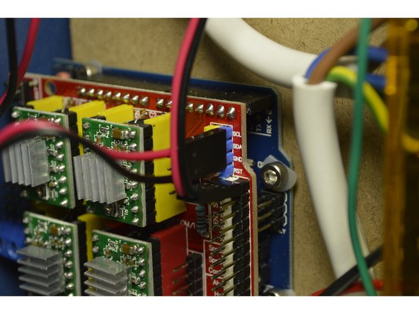 The red cable goes on the SCL pin and the black cable goes on the GND pin