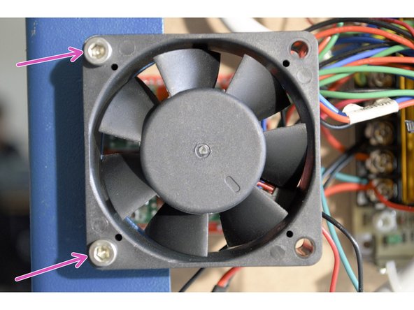Remove the two screws mounting the fan above the electronics
