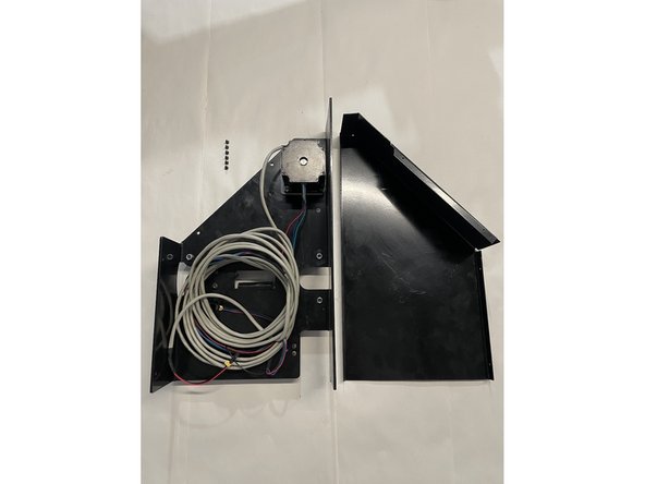 Remove the cover from the right gantry by unscrewing the 6 screws as shown in the pictures with the philips screw driver