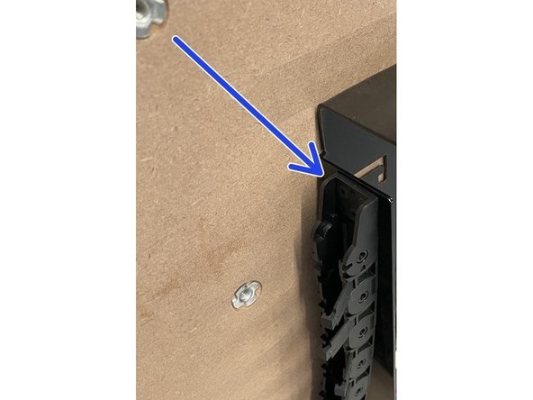 The drag chain can only be fastened in one orientation due to the spacing of the holes.  So if the 3 holes in the drag chain does not line up with the holes in the steel plate, flip the drag chain around.