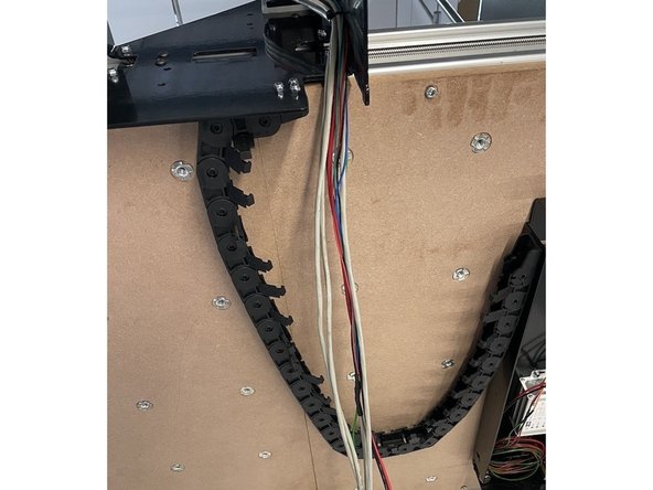 Mount the other side of the drag chain to the Electronics Assembly with 3 x M4x12 Counter Sunk Screws and 3 x M4 Lock Nuts.