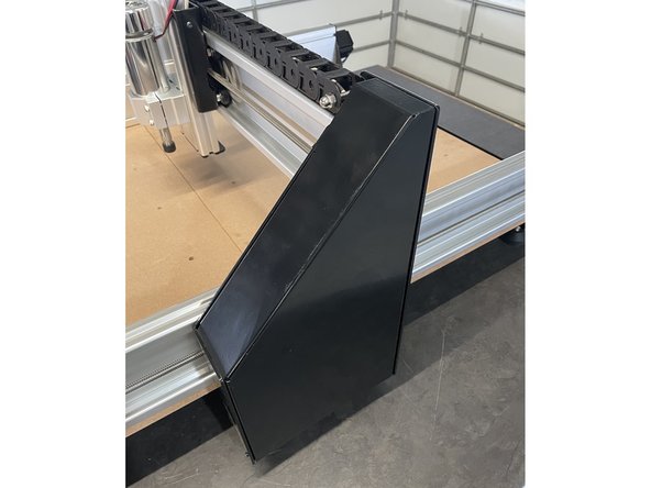 Turn the machine back on its feet and mount the left and the right Gantry Cover Plates back to the left and the right gantries with the screws they were fastened with.  Each cover plate is fastened with 6 x black self tapping screws.