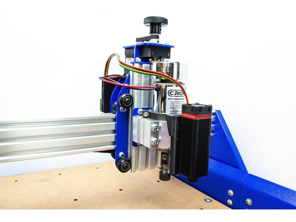 Slot the laser into the bracket as shown