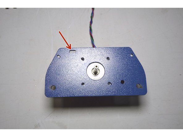 Place the X-Motor Plate on top of the X-Motor with the slot on the top left corner