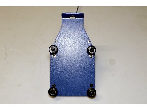 Insert the Spindle Assembly by pushing the two V-Wheels on the right to the right hand side