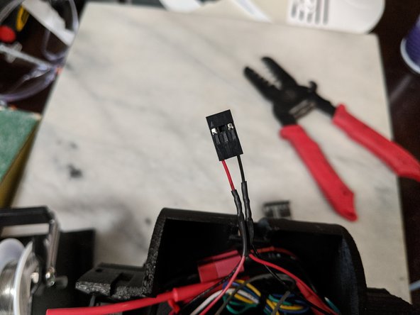 Using a 3 pin housing, insert the speaker wires on the outer positions of the housing as seen in Pic 2.