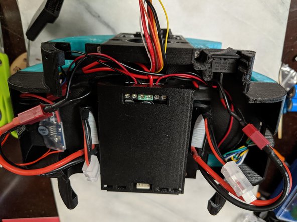 Plug them into the two plugs we wired up with the main wire harness earlier and tuck the wires in the sides of the Top Frame to keep them out of the way.