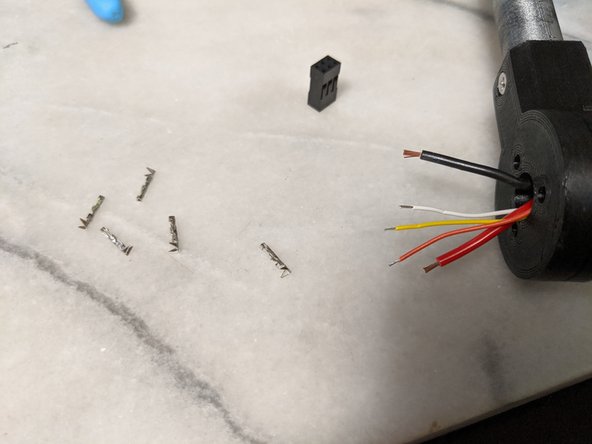 First trim the wires but leave enough length where you are comfortable with stripping the wires and crimping on them. How much I left is seen in Pic 1.  We will also be using a 6 pin (2 rows of 3) female plug and 5 female crimps as seen in the pic.