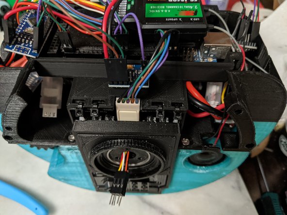 Here you will secure the Arduino mount to the Top Frame.