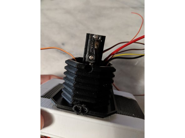 Install the servo horn facing up as shown in Pic 2 and secure with the machine screw that comes with the servo.