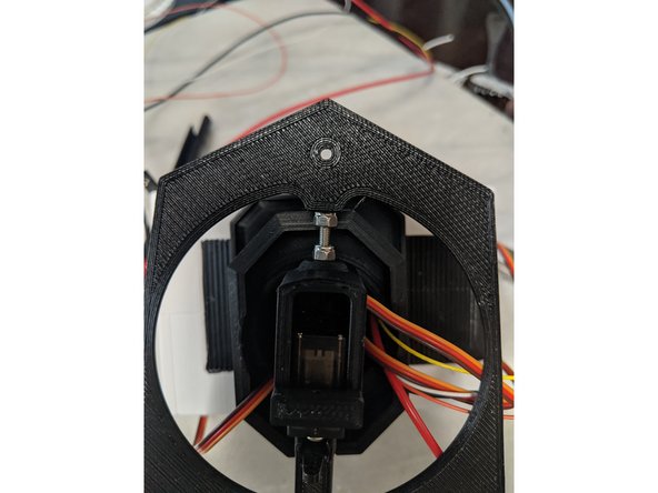 You will not need to epoxy this servo horn on, as it will be secured in place with the second nut we installed earlier on the screw.