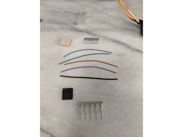 This step will use the crimps and housing that came with the motor controller in a small baggie. You will also be using a 5 pin single row housing and 5 male crimps.  For wires you will use 4 signal size wires, and one ground wire.