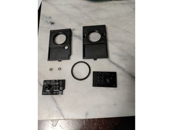 You will use 2 M4 Square Nuts, Front and Rear Frame Insert prints, and the Resin Frame Inserts long with the Ring as shown in Pic 1.