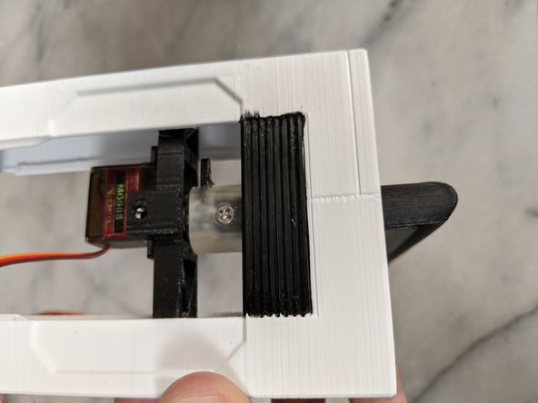 Insert the HeadBar into the Headbox and into the ServoCouple until the hole through the HeadBar lines up with the Coupler as seen in Pic 2.