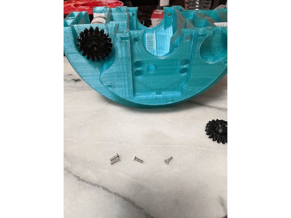 Slide PololuGearA onto the first motor as shown in Pic 2.  Pic 2 shows the &quot;front&quot; side which is also side A for the Lazy Susan files if you are keeping track.