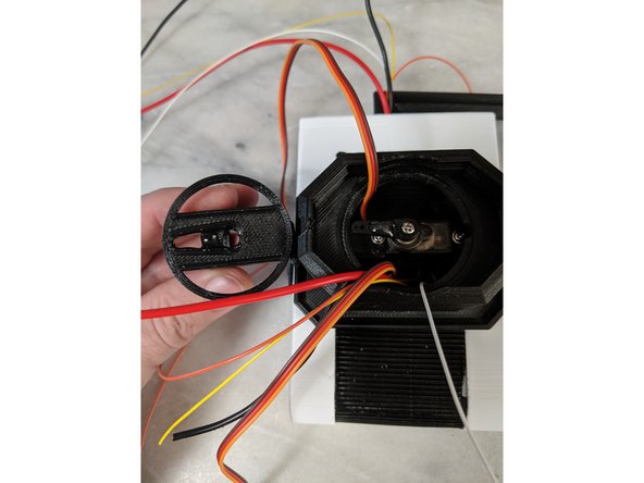 Here you will use 2 part epoxy to secure the servo horn to the TopNeck print.