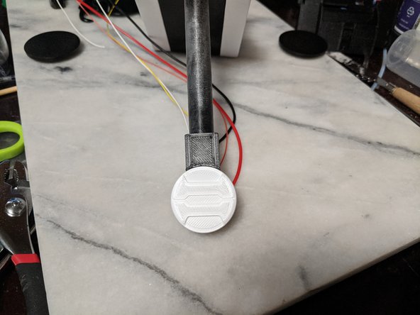 Push the MainBarCap in the orientation you want onto the screw so the epoxy covers the screw head.