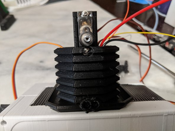 Insert the servo into the TopNeck print and secure with the mounting screws as shown in Pic 3.  There is a hole in the main neck print for a screwdriver to secure the servo with the mounting screw.