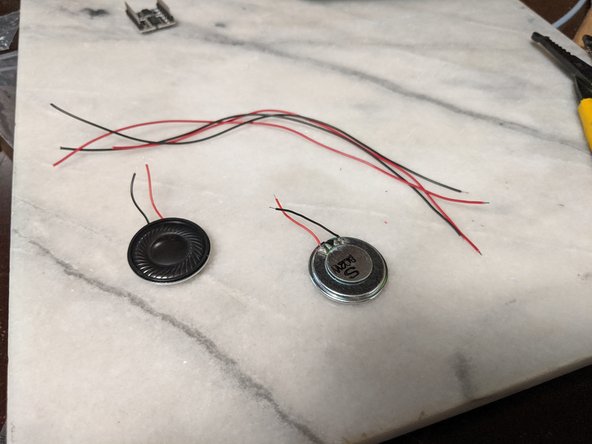 My speakers came with a tiny amount of wire on them which is pretty much useless, so I removed the wires and soldered on some longer wires.