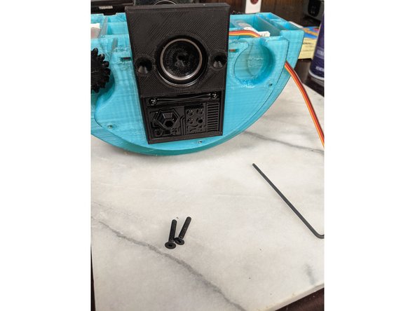 Insert the MainBar print into the bearing in the FrontFrameInsert as shown in Pic 2.  I personally lightly sanded the end of the MainBar print to fit snug into the bearing as initially it would not insert.  You can see this in Pic 1 on the exposed end of the MainBar.