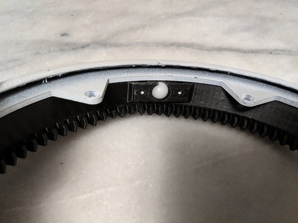 Feed in all the bearings one at a time and push them in using the next bearing to push the previous one in until they all fit in as shown in Pic 2.