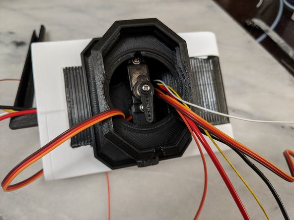 Insert the servo as shown in Pic 2 and secure with the mounting screws.