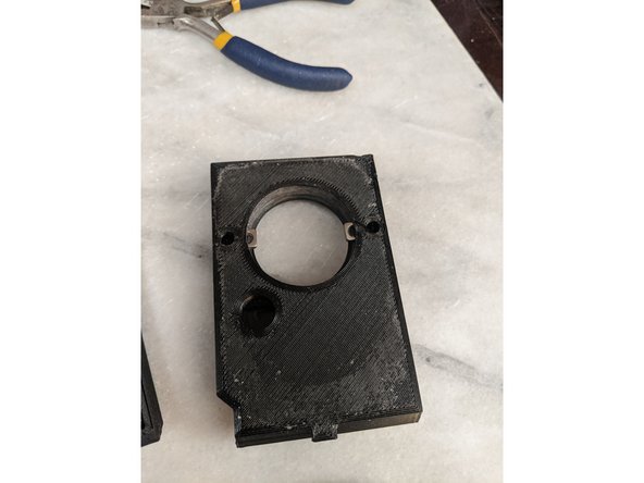 FrontFrameInsert has 2 pockets for the M4 Square Nuts.  Insert the Square Nuts into the pockets as shown in Pic 2.  Insert the nuts fully until the threads align with the holes.