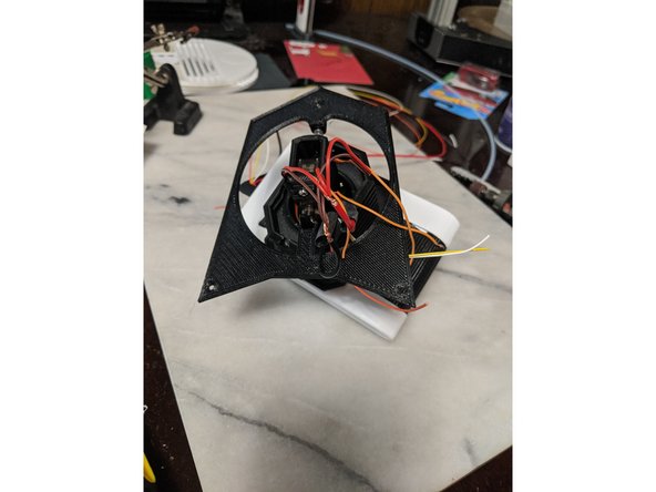 The servos have 3 wires, mine are orange, red, and brown.  Separate the servo wires and strip the red and brown wires back about 1/4&quot; and combine the 3 servo red wires and the 3 servo brown wires (some servos have black as ground).  Also strip the large red and black wires that will go to the body. Use pic 2 as reference.