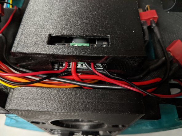 I rolled up and put a zip tie on the remaining motor wires to keep them clean and out of the way.