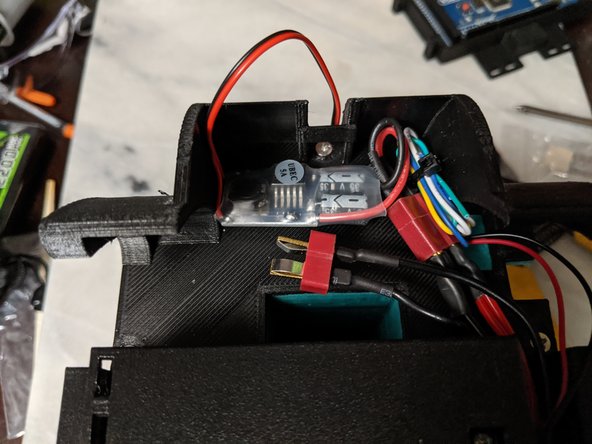 I tucked the UBEC into the side of the frame as shown in Pic 2.  You can also see my folded up wires from the motor zip tied and tucked away as well.