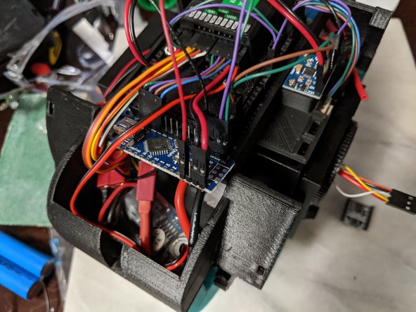 The 4 pin housing plugs in first.  The data wires will line up with the TX and RX pins, and the black wire will go to GND pin.  See Pic 1 for details.
