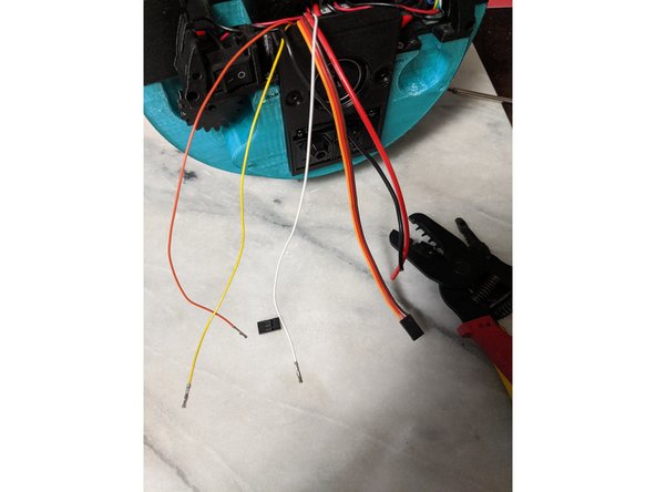 Strip the ends of the 3 thin servo wires and put on a female crimp on each one as shown in Pic 2.