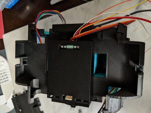 Also seen in Pic 1, you will want to take the wires coming out of the Main Bar and the center servo wires and pull them back to the side as shown in Pic 1 as well.