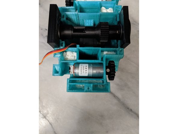 Fold up the paper or foam and start filling the cavities to fill out the open areas to secure the ballast in place.  The first paper towel I shoved in can be seen in Pic 2.