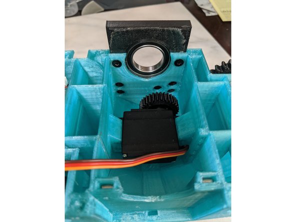 From the inside of the frame and the rear of the FrontFrameInsert, insert the screws into the two holes and secure the insert into the frame as shown in Pic 3.