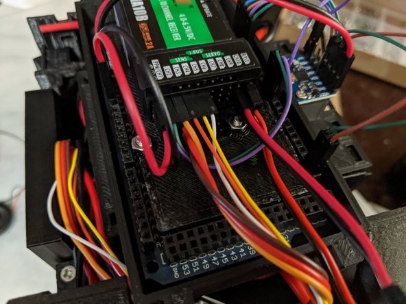 You will now plug these harnesses into the RC receiver.