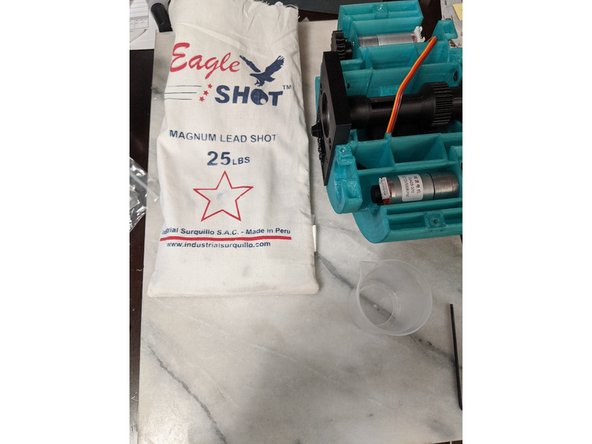 Here we will add the lead shot for ballast to keep everything stable. I purchased a bag of lead shot from my local Cabelas outdoors store.  This is a large bag I purchased for other droids as well, and had lead left over.  You can purchase lead shot from hunting departments of sports stores or Amazon.