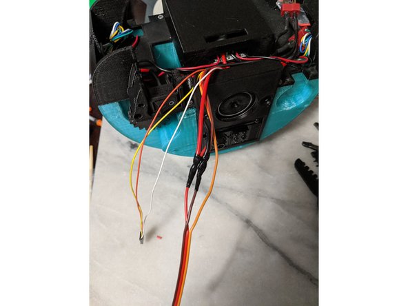Attach the power wires to the wires on the servo as shown in pic 2 and solder them on for a good connection.