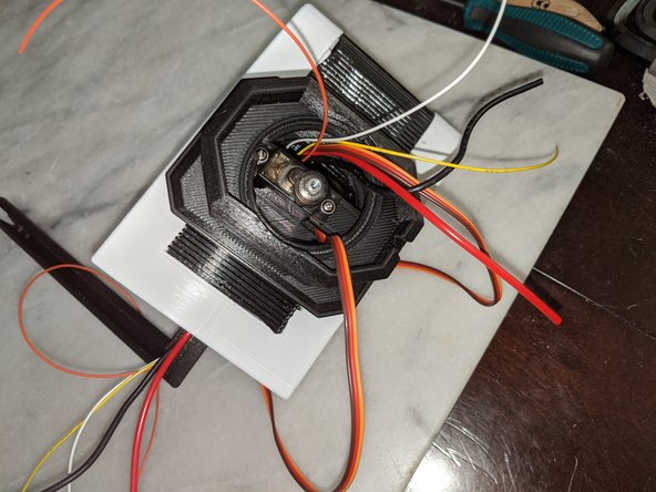 There is a notch in the neck for the servo wires so they do not get pinched.  You can see this location in Pic 2.