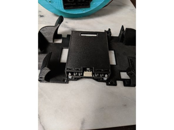 Attaching the screws as seen in Pic 2 is fairly difficult because the white parts that are threaded tend to spin on the motor driver when trying to tighten the screws.  The way I did it was use a very long thin flat blade screwdriver to put pressure and hold the white threaded piece in place while tightening the screw.