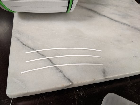 I used 3 pieces of filament to make the antenna.  1.75mm filament worked perfectly.  I do not know the exact measurement so I went with what looked good.  I used white filament that was approximately 115mm long and straightened it as much as possible with my fingers.