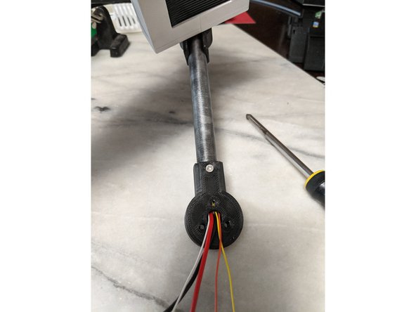 Secure the MainBarHolderA print with the 10mm long M3 screw to the HeadBar.  Do not push on the screw and let it screw in smoothly so you do not push out the Square Nut that is sitting inside the HeadBar.  Tighten the screw to secure as seen in Pic 3.