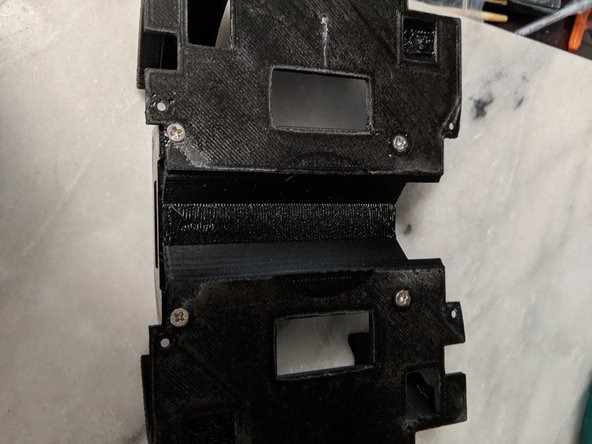 Make sure the MotorDriverFrame is orientated correctly.  See Pics 1 and 3 for reference.  There is a larger notch cut out of the TopFrame, and this is the side where the screw terminals on the Motor Driver will be located.