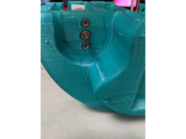 Using 2 M3 x 10mm long countersink screws per motor, attach the motors to the MainFrame as shown in Pic 2.