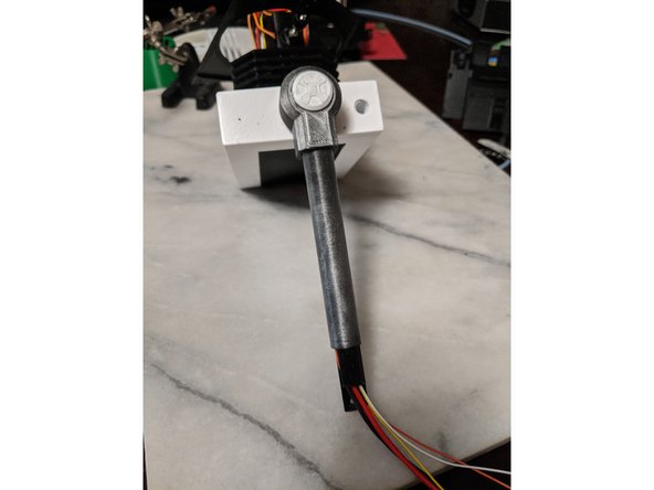 Slide the wires into the  BarSkin print and then slide the BarSkin over the Headbar all the way up the HeadBar with the printed notch toward the top.  Keep the wires in the channel of the HeadBar.   When fully inserted, it will look like Pic 2.