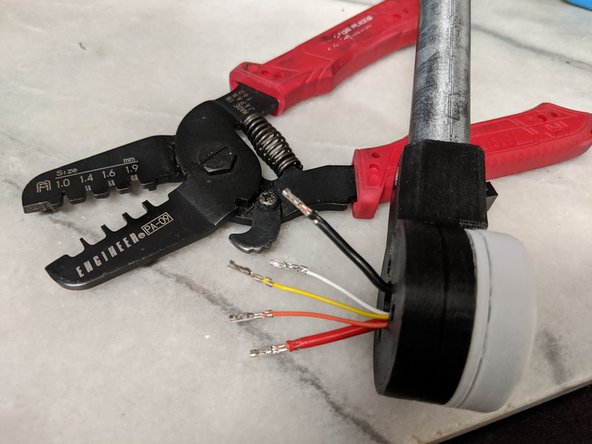 Next separate the crimps from the row, and strip the ends of the wires.