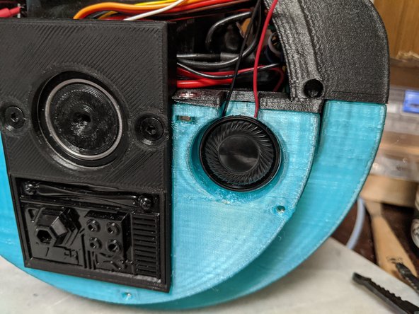 Mix up some 2 part epoxy and put a small amount on the back of the speakers as shown in Pic 1.