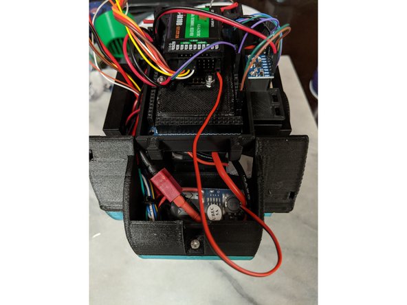 The UBEC will plug into the B/VCC port of the receiver.  The middle pin is the positive and the lower pin is the ground.